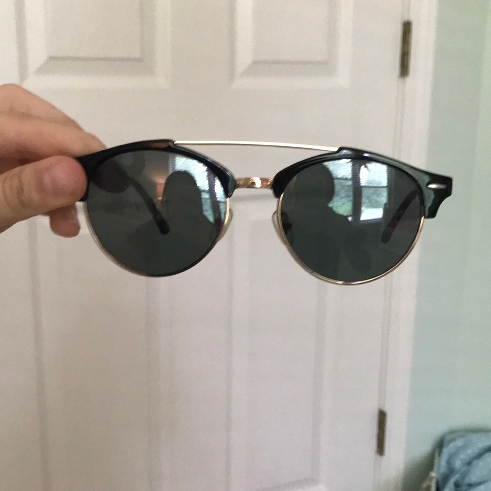 Black sunglasses with gold accents